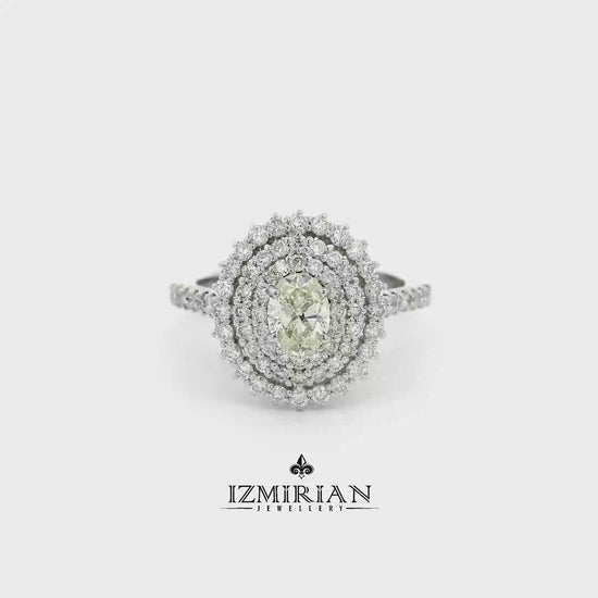 Oval diamond triple halo ring in white gold shown in motion