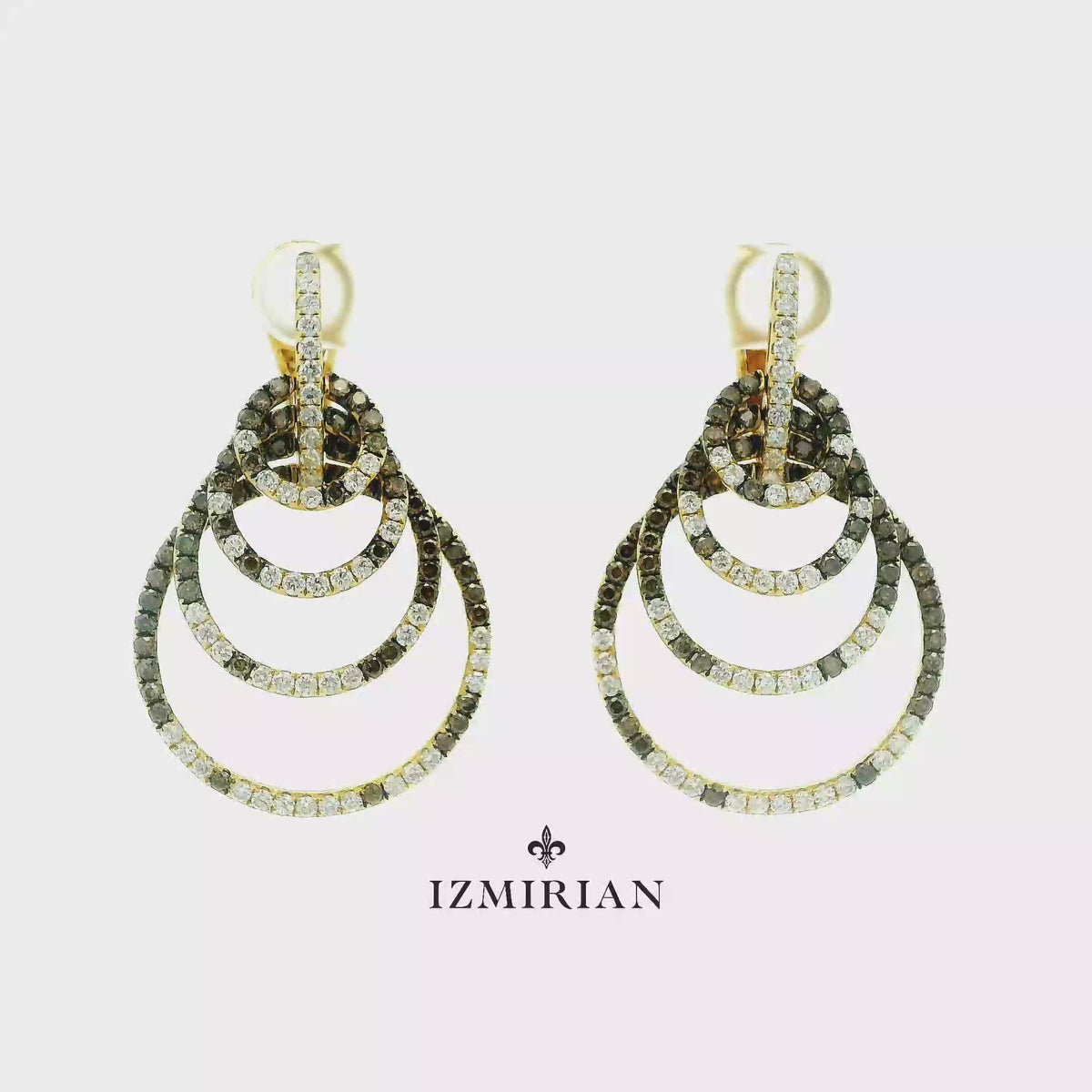 Tiered yellow gold diamond drop earrings shown in motion